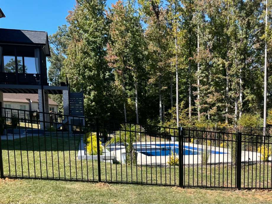 fenced pool in back yard