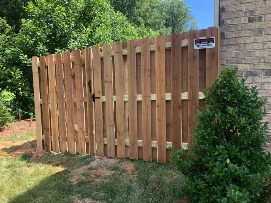 wooden fence by a house