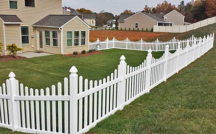 Vinyl picket fence built and installed by Diversified Fence Builders.